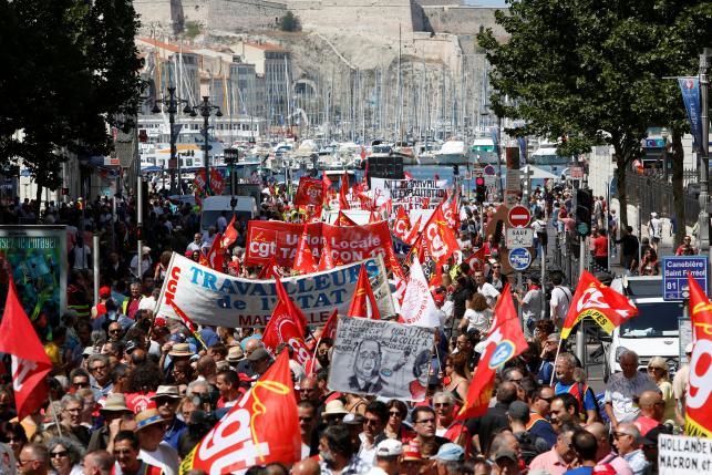 General view of French trade union employees who march with banners during a demonstration against plans to reform French labour laws in Marseille